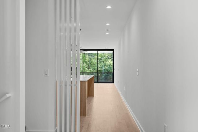 a view of hallway with a large window