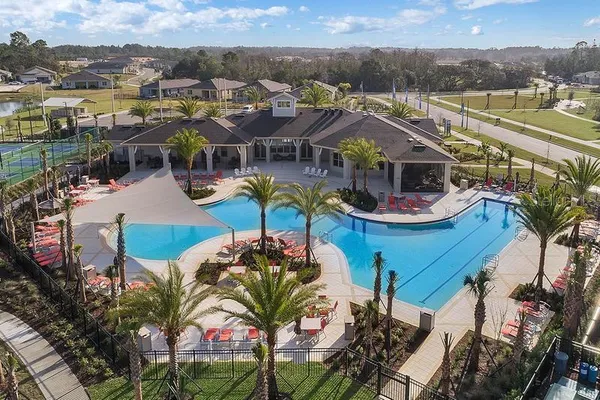 a bird view of multi story residential apartment building with yard