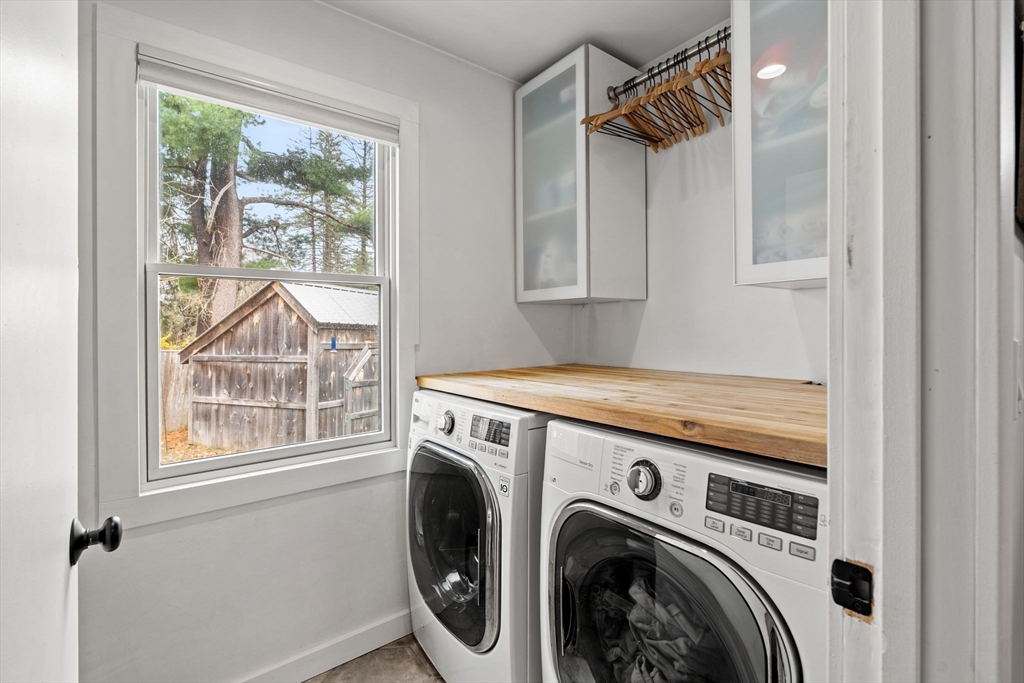 8 R Rolfe's Lane Newbury, MA 01951 - Photo 13 of 42 a view of washer and dryer near a window
