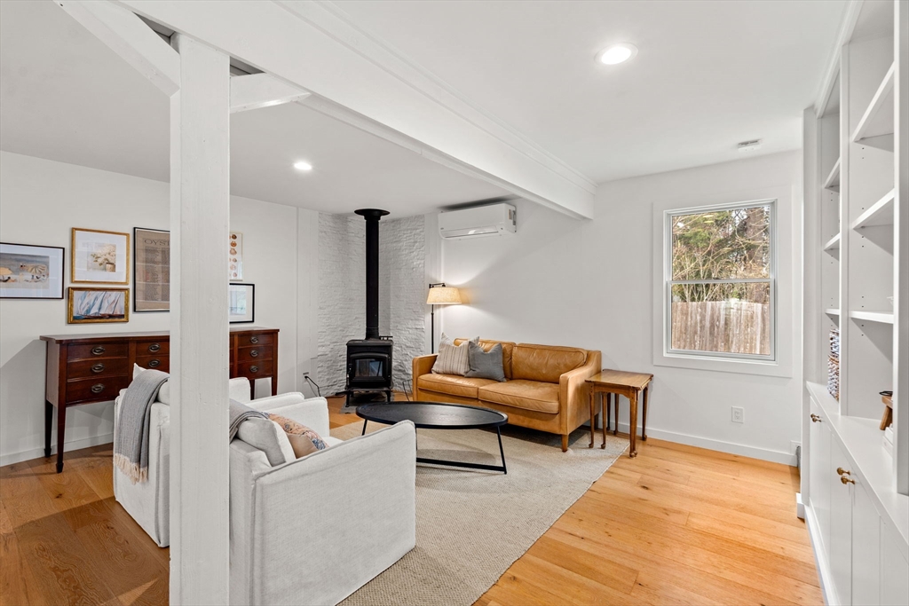 8 R Rolfe's Lane Newbury, MA 01951 - Photo 21 of 42 a living room with furniture and a lamp