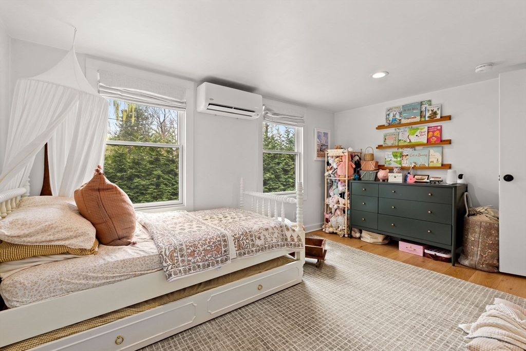 8 R Rolfe's Lane Newbury, MA 01951 - Photo 30 of 42 a bedroom with a bed dresser and a window