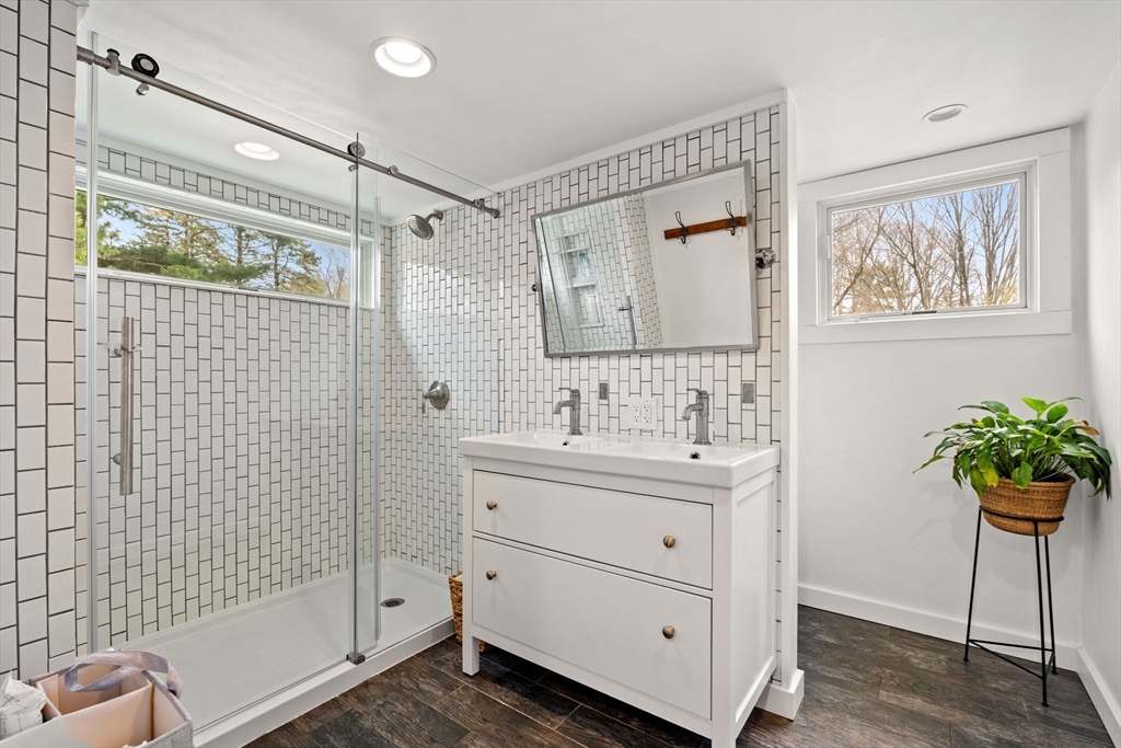8 R Rolfe's Lane Newbury, MA 01951 - Photo 33 of 42 a bathroom with a sink a mirror and a shower