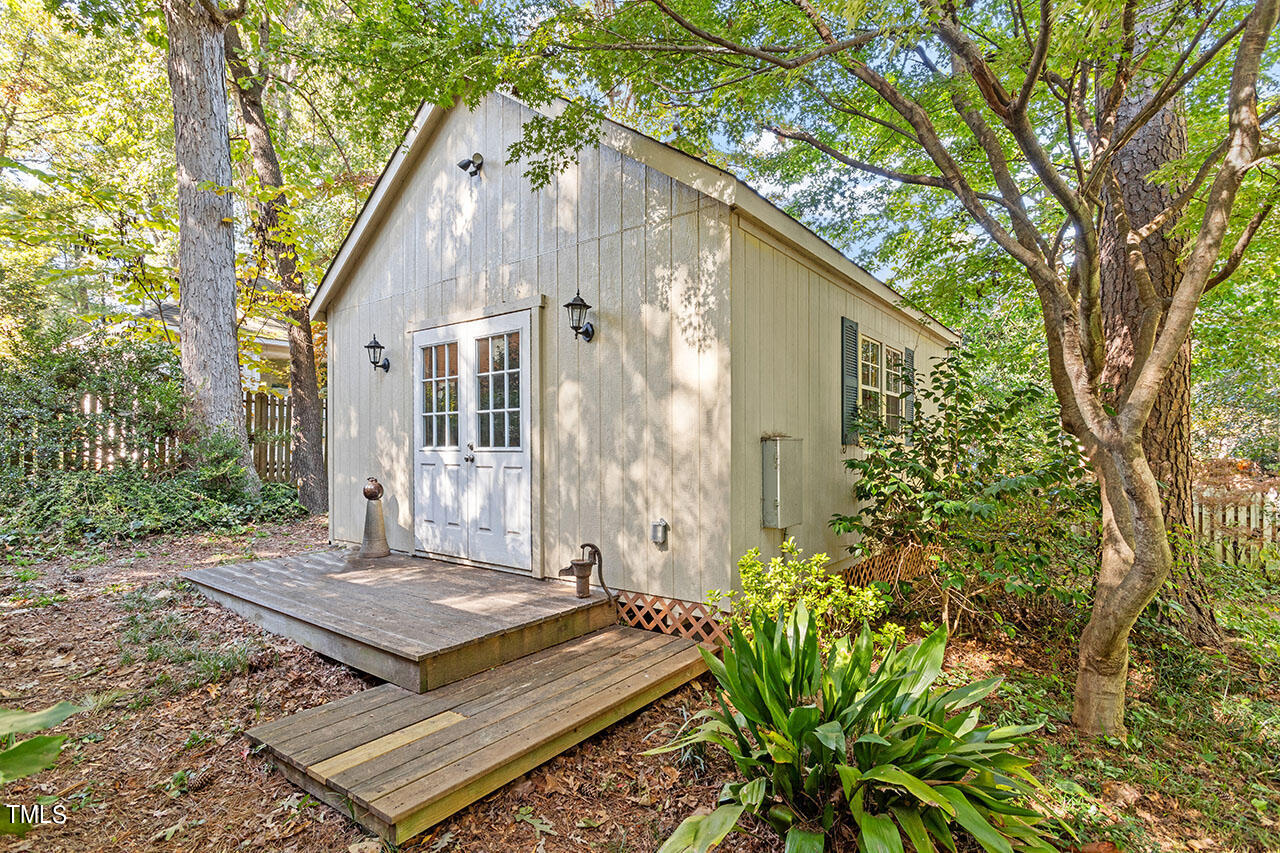 3408 Caldwell Drive Raleigh, NC 27607 - Photo 12 of 46 a view of a house with a yard