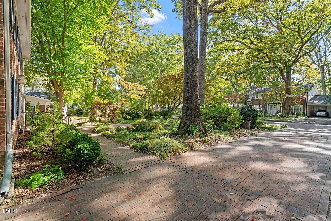 3408 Caldwell Drive Raleigh, NC 27607 - Photo 13 of 46 a backyard of a house with lots of green space