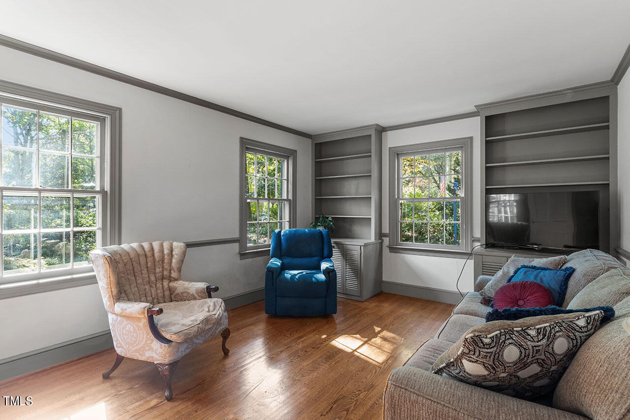 3408 Caldwell Drive Raleigh, NC 27607 - Photo 22 of 46 a living room with furniture and a flat screen tv