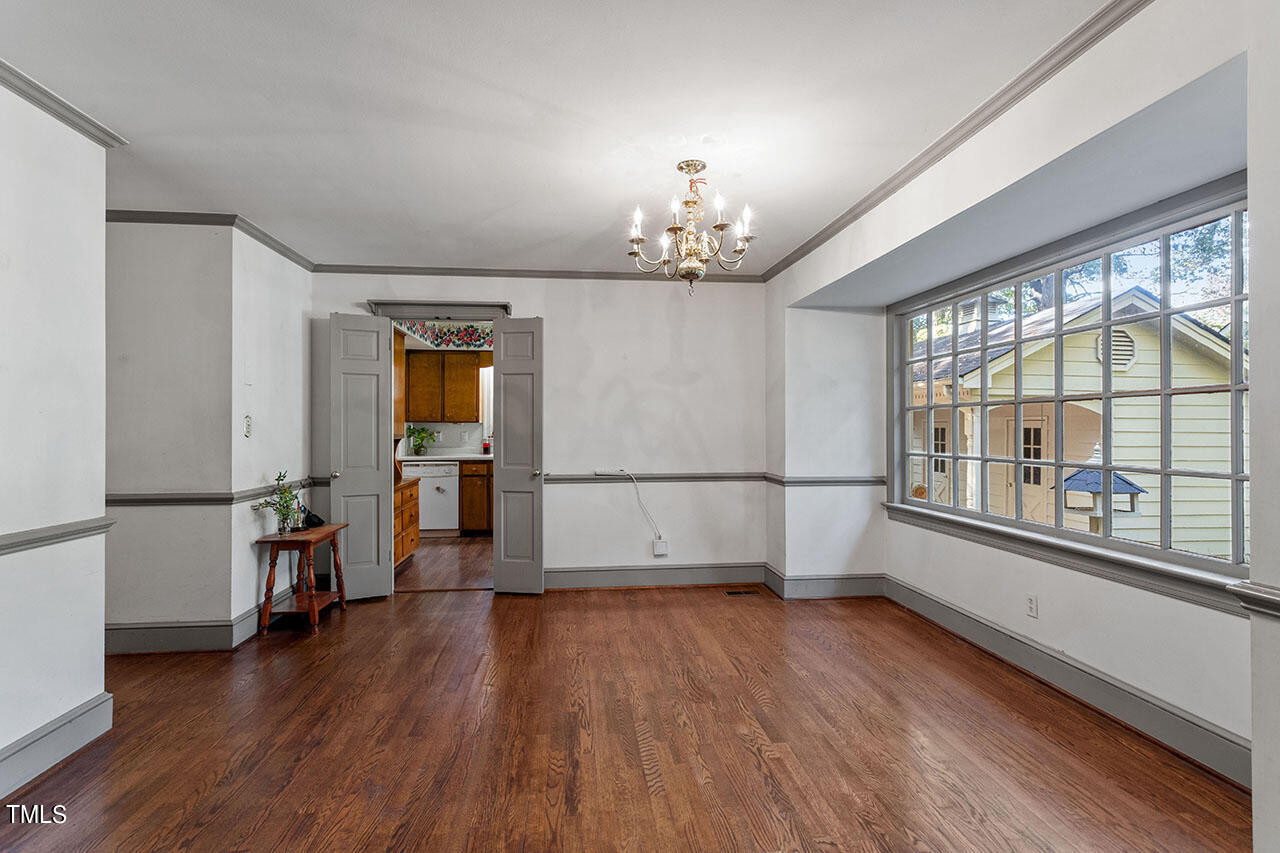 3408 Caldwell Drive Raleigh, NC 27607 - Photo 25 of 46 wooden floor in an empty room with a window