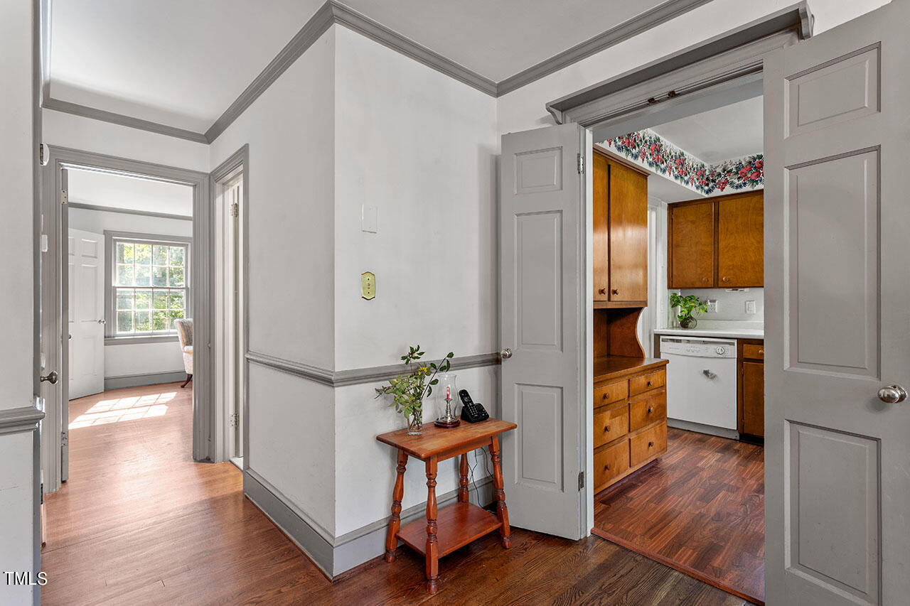 3408 Caldwell Drive Raleigh, NC 27607 - Photo 26 of 46 a view of hallway with furniture and wooden floor