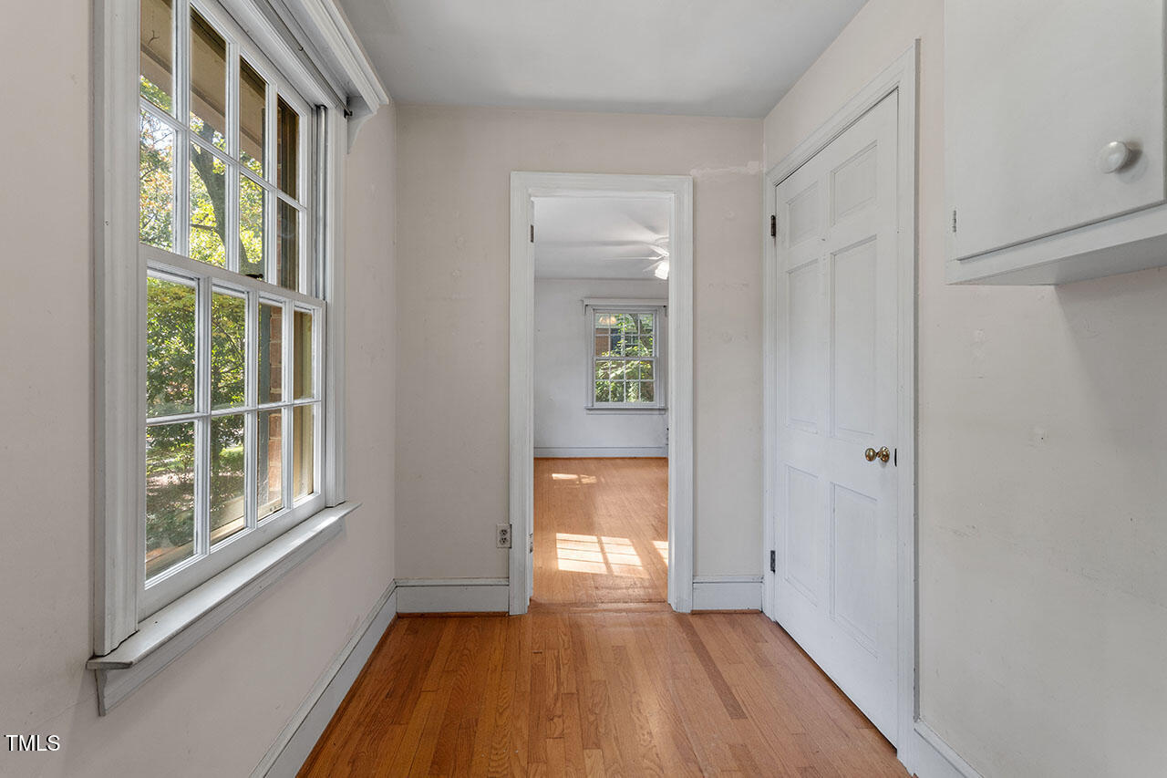 3408 Caldwell Drive Raleigh, NC 27607 - Photo 40 of 46 a view of an entryway with wooden floor and windows