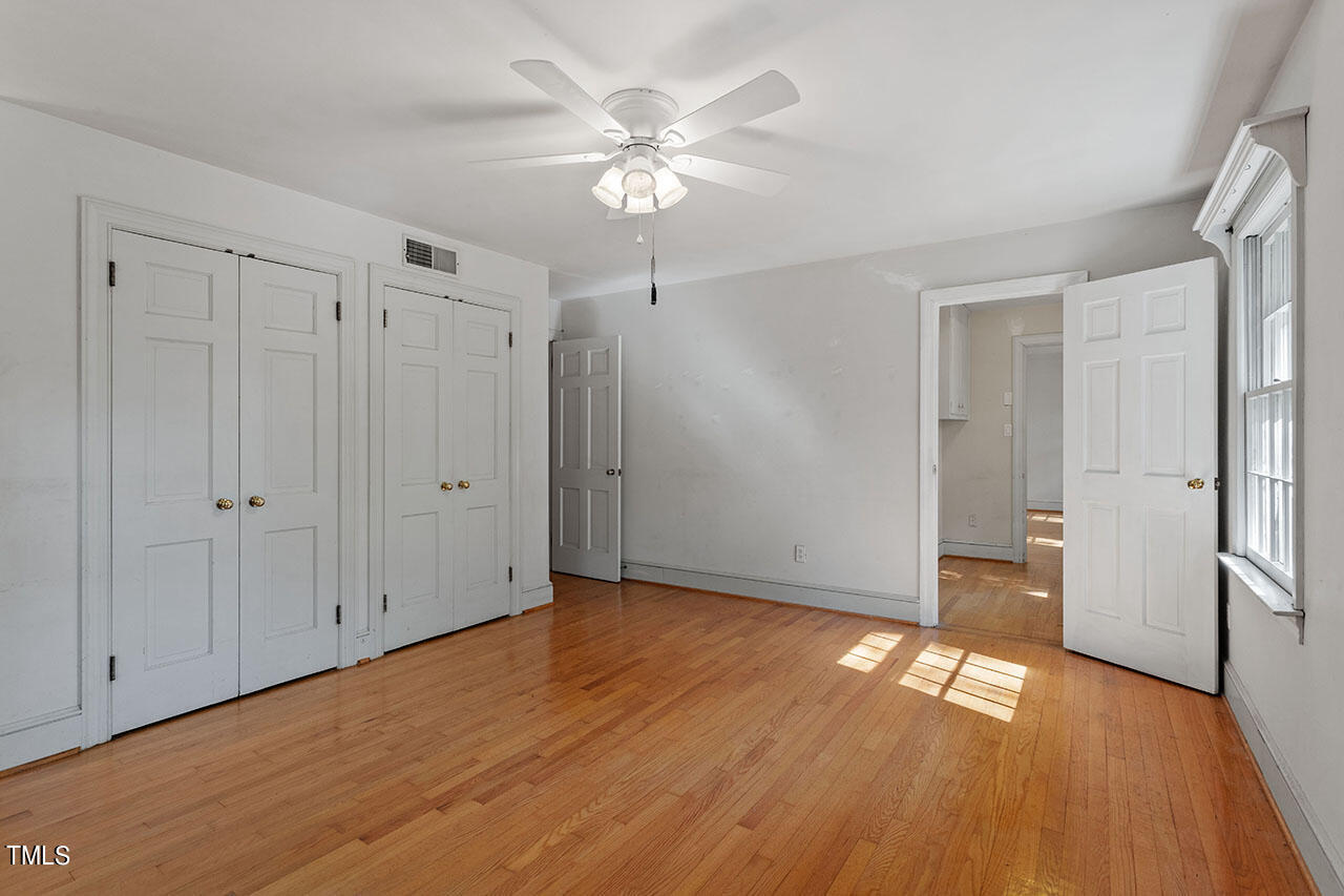 3408 Caldwell Drive Raleigh, NC 27607 - Photo 41 of 46 a view of an empty room with wooden floor
