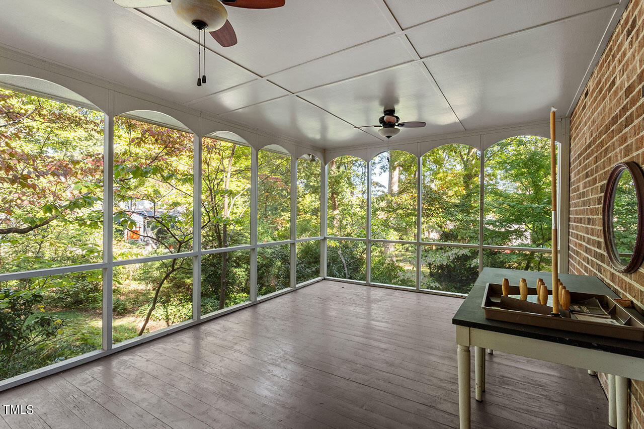 3408 Caldwell Drive Raleigh, NC 27607 - Photo 7 of 46 a view of a living room with hardwood floor and large windows