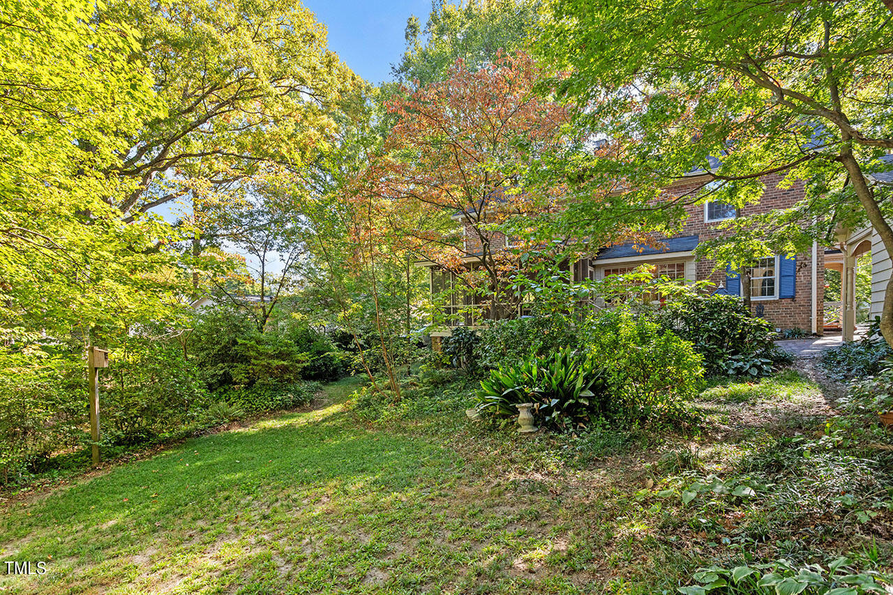 3408 Caldwell Drive Raleigh, NC 27607 - Photo 9 of 46 a view of a big yard with plants and large trees
