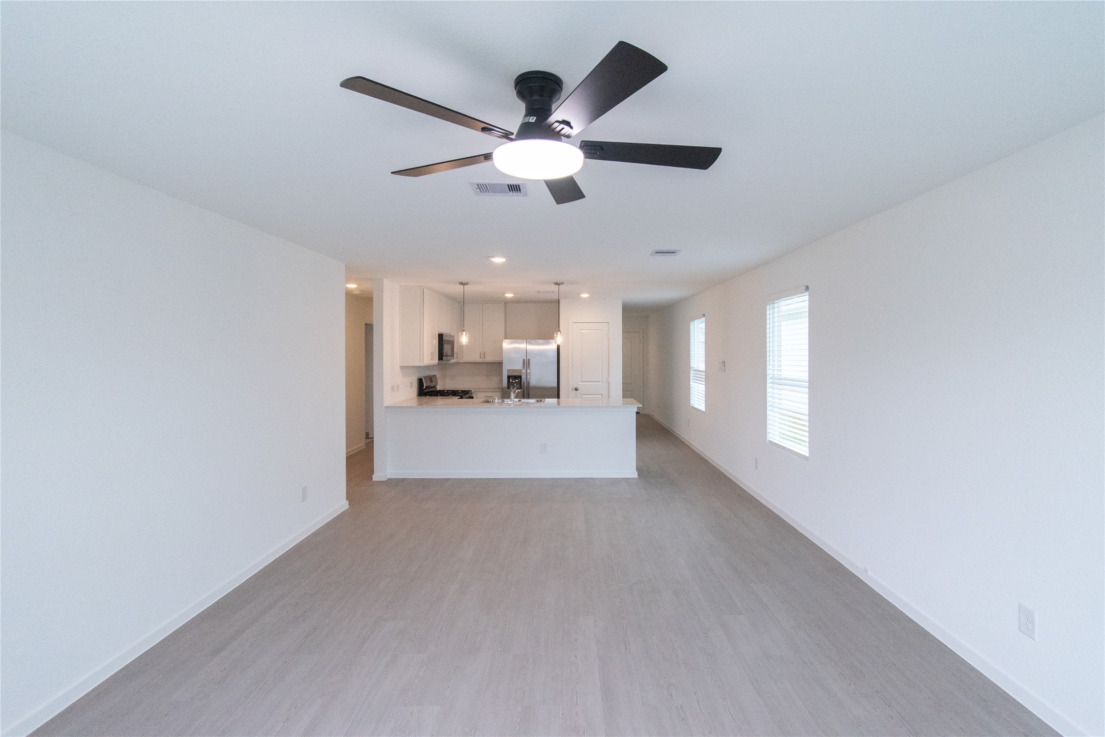 31432 Moore Road Magnolia, TX 77354 - Photo 12 of 26 a view of a livingroom with a ceiling fan and window