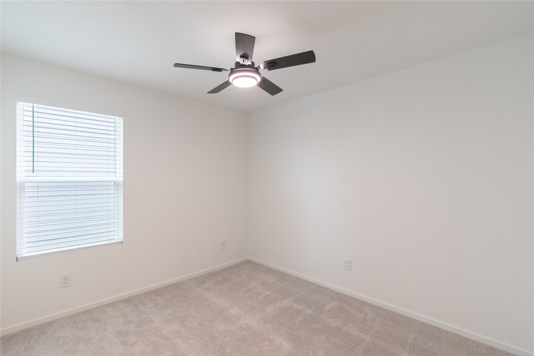 31432 Moore Road Magnolia, TX 77354 - Photo 20 of 26 an empty room with a window and a fan