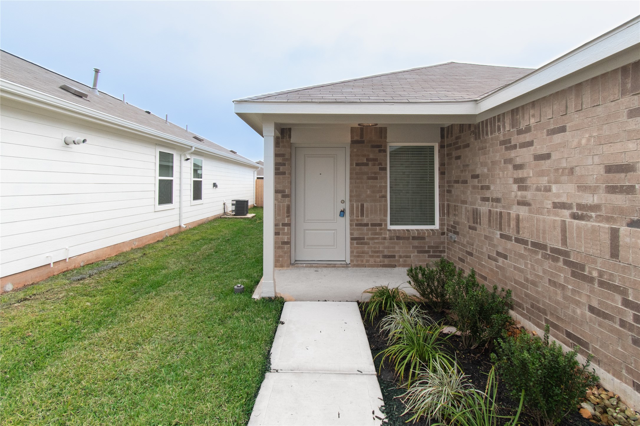 31432 Moore Road Magnolia, TX 77354 - Photo 3 of 26 a front view of a house with a yard