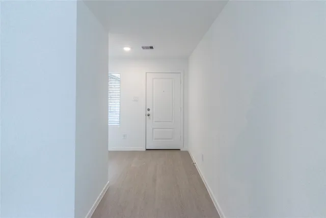 a view of hallway with closet
