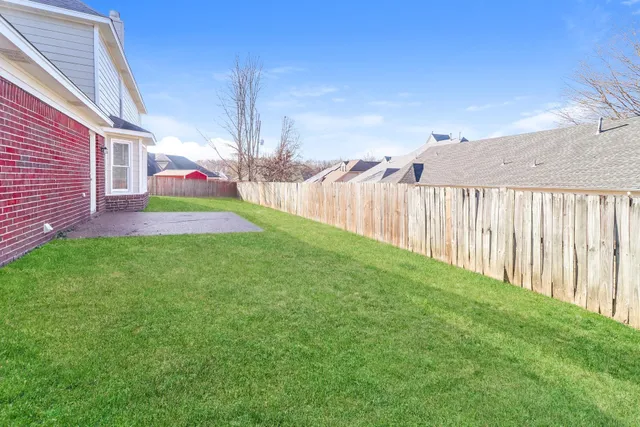 a view of a backyard with a garden