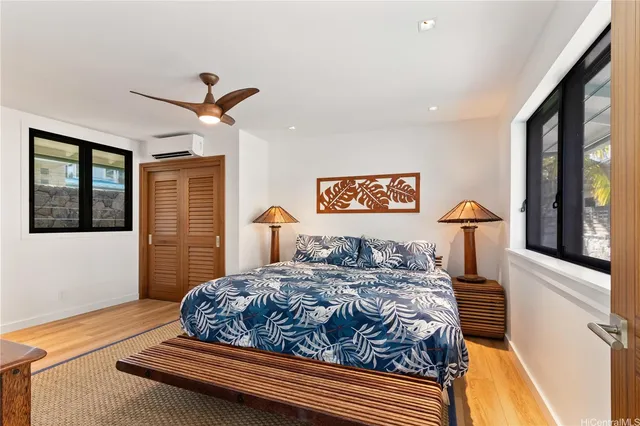 a bedroom with a large bed and a window