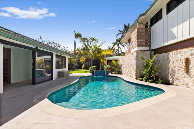 a view of a house with swimming pool