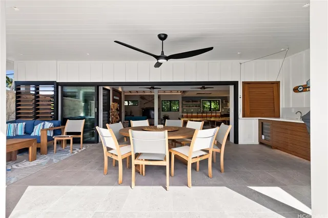 a dining room with furniture wooden floor and a rug