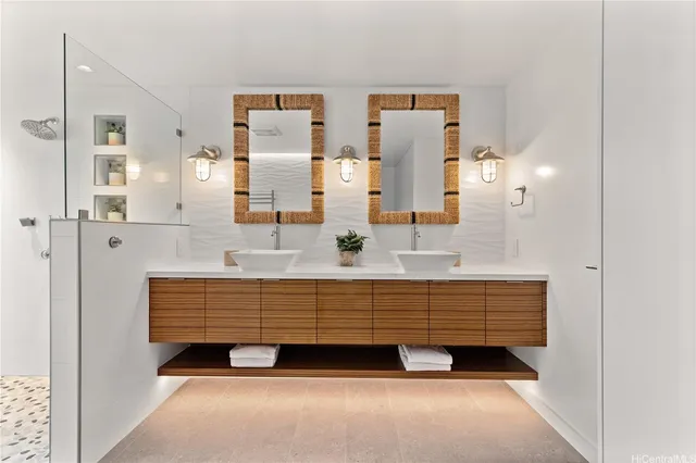 a bathroom with a sink double vanity and shower