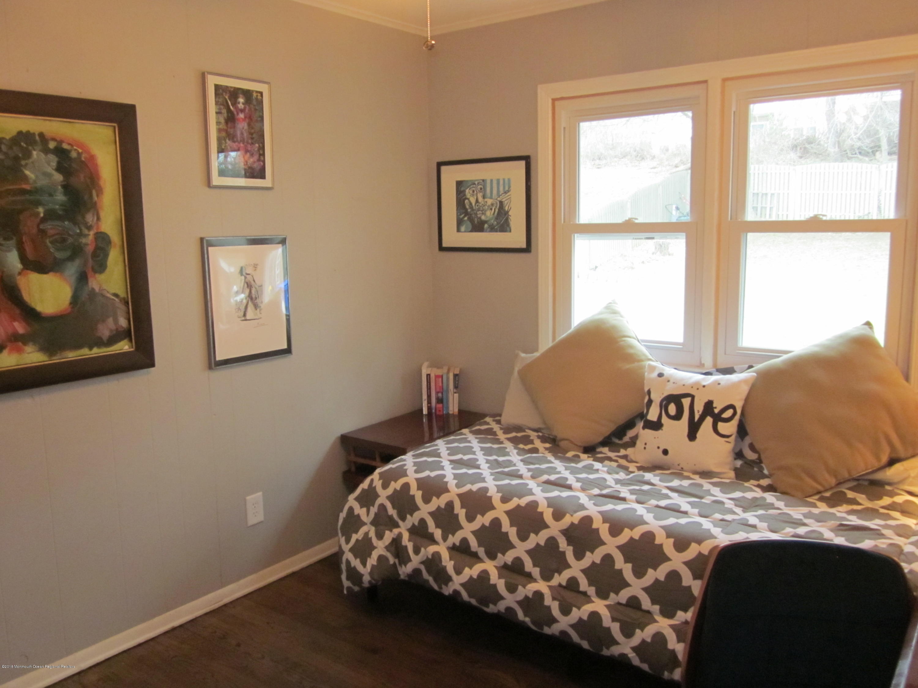 18 Crestview Drive Middletown, NJ 07748 - Photo 11 of 22 a bedroom with a bed and painting on the wall