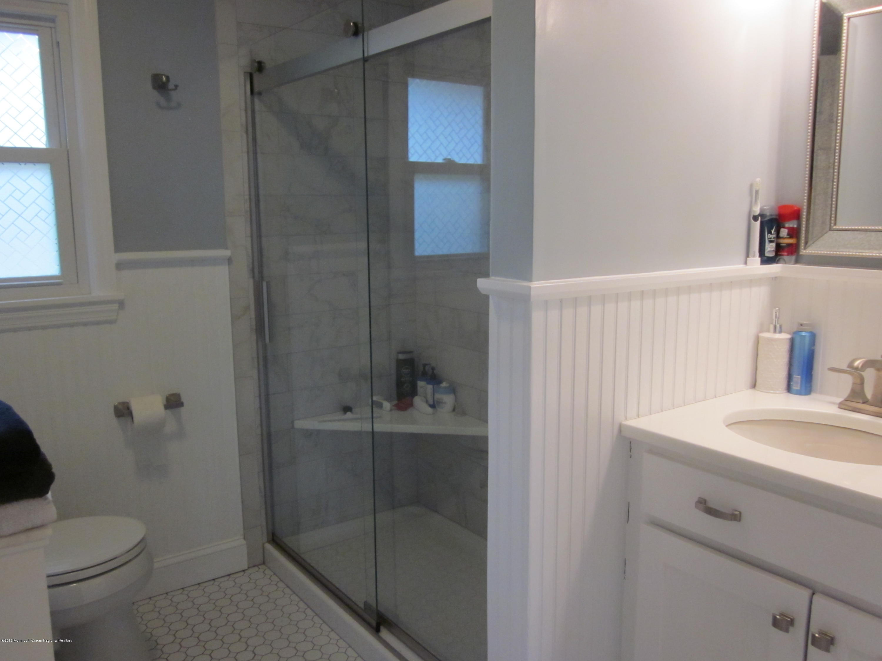 18 Crestview Drive Middletown, NJ 07748 - Photo 17 of 22 a bathroom with a sink toilet and vanity