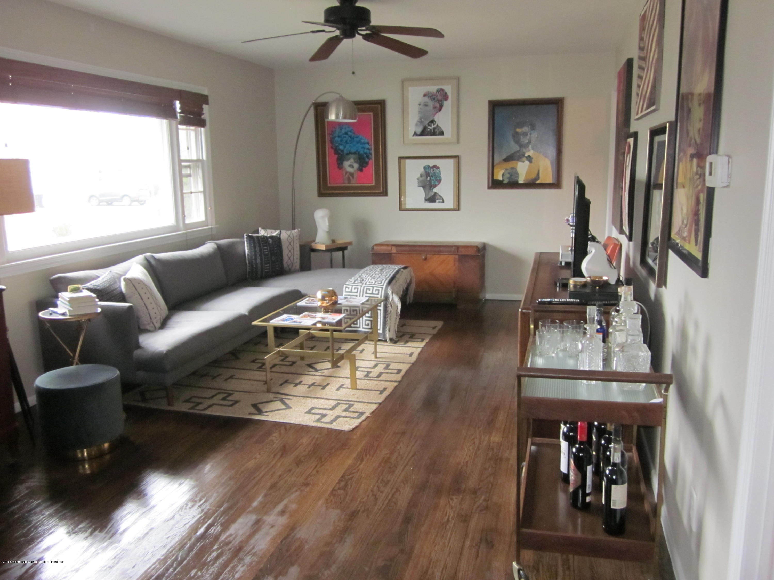 18 Crestview Drive Middletown, NJ 07748 - Photo 2 of 22 a living room with furniture and a flat screen tv