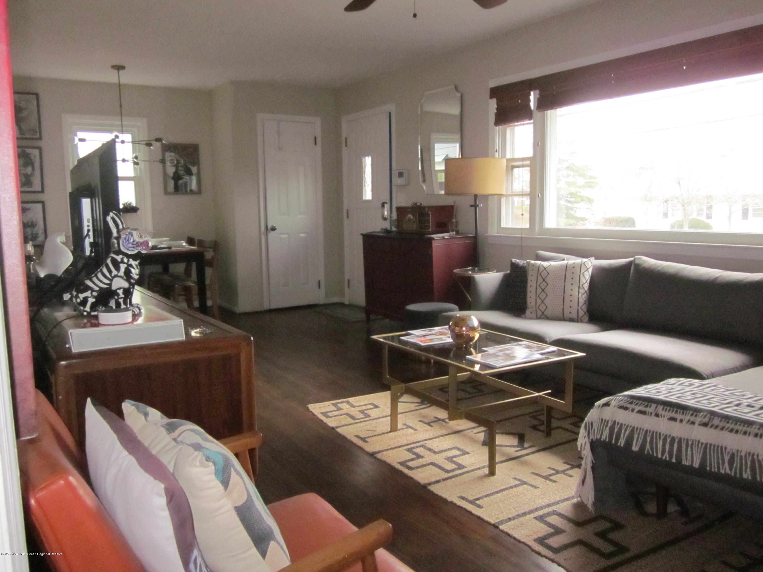 18 Crestview Drive Middletown, NJ 07748 - Photo 3 of 22 a living room with furniture and a large window