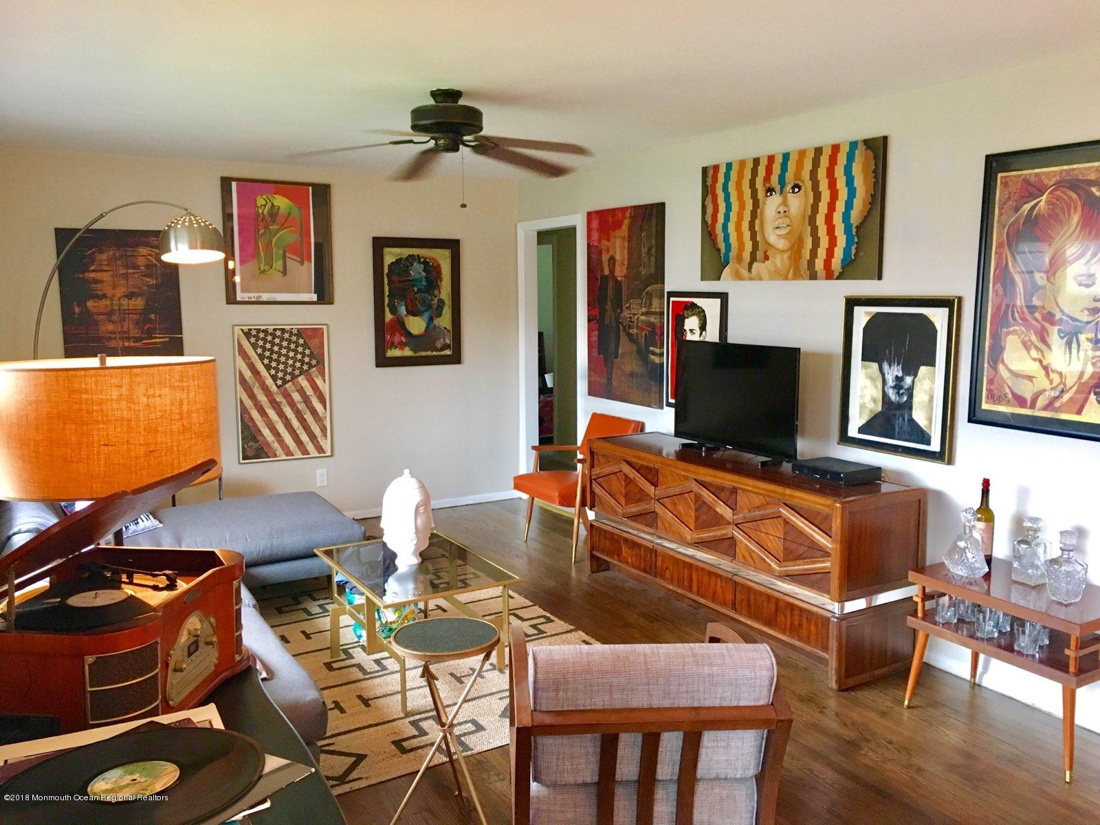 18 Crestview Drive Middletown, NJ 07748 - Photo 4 of 22 a living room with furniture and a flat screen tv