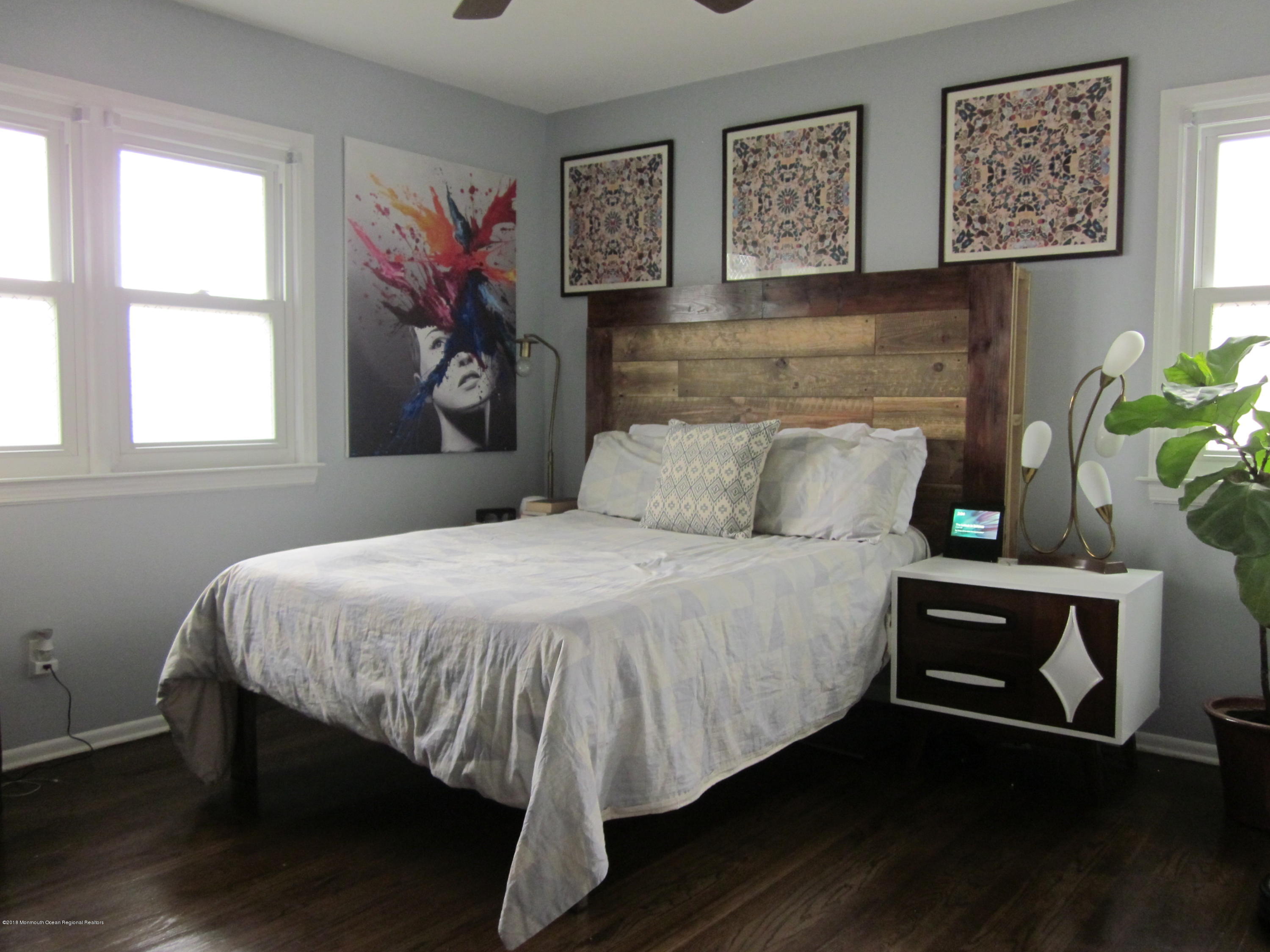 18 Crestview Drive Middletown, NJ 07748 - Photo 8 of 22 a bedroom with a bed and wooden floor