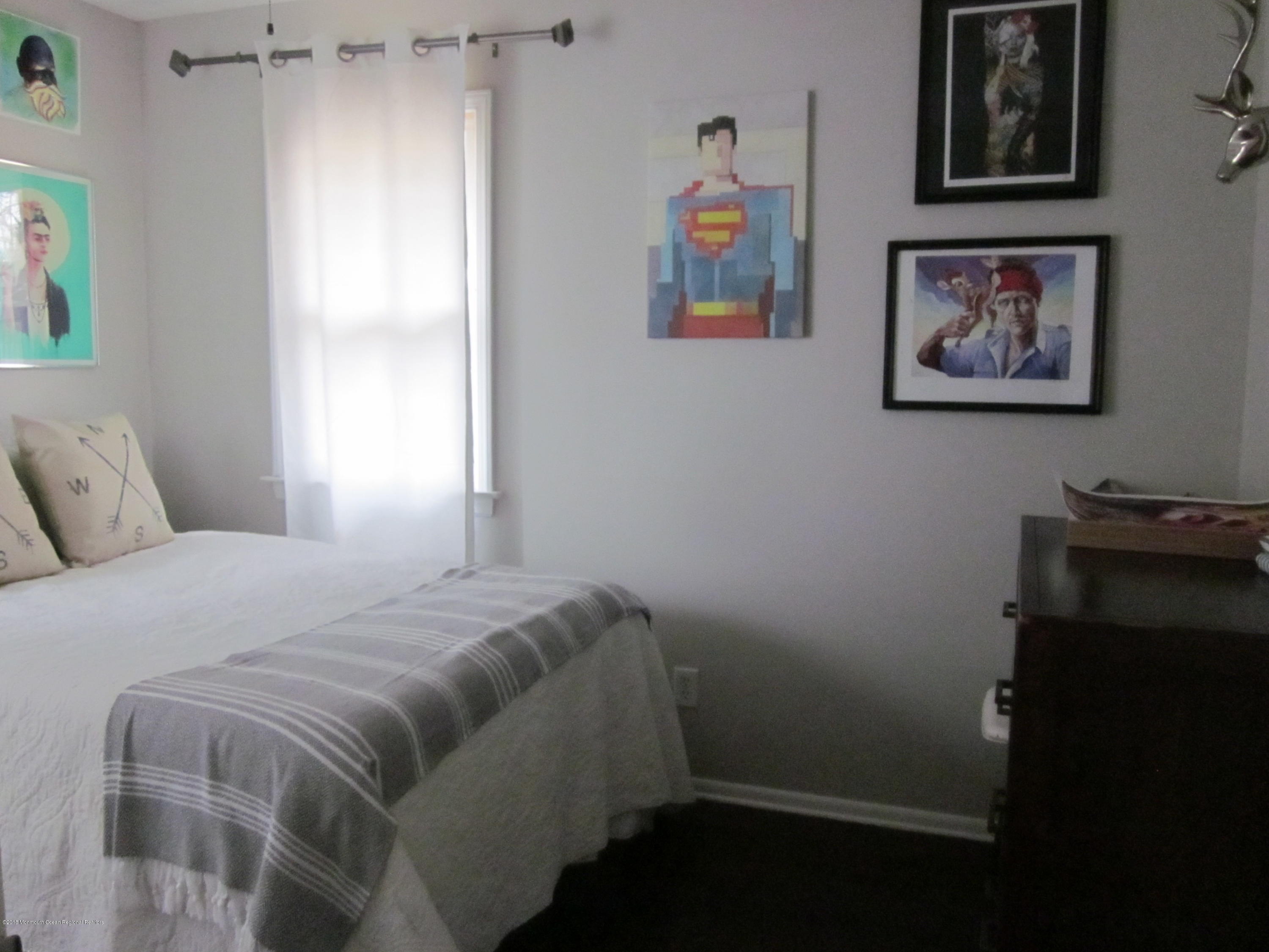 18 Crestview Drive Middletown, NJ 07748 - Photo 10 of 22 a bedroom with a bed and wall painting