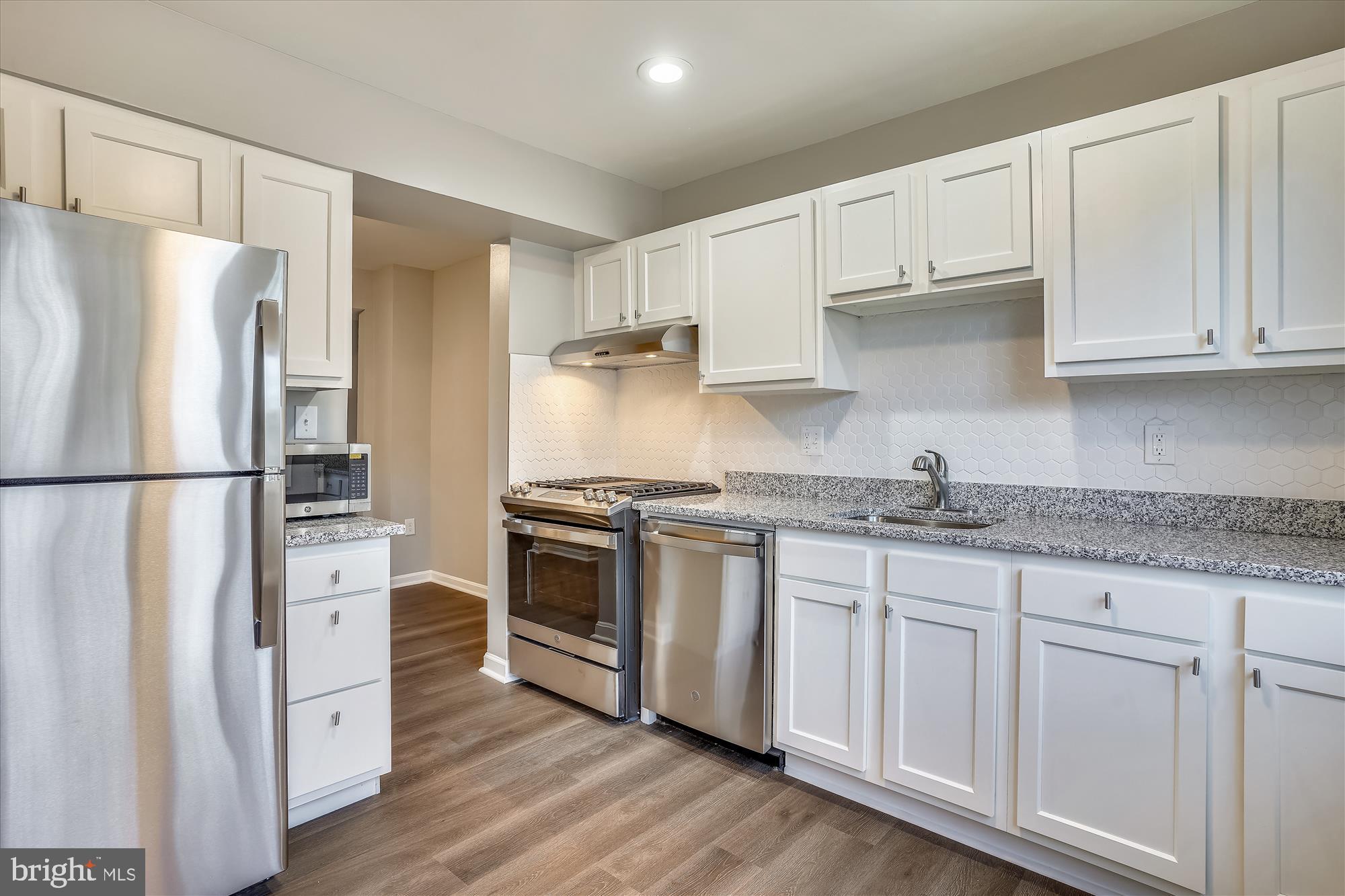 9202 Sprucewood Road Burke, VA 22015 - Photo 5 of 21 a kitchen with stainless steel appliances granite countertop a refrigerator sink and stove