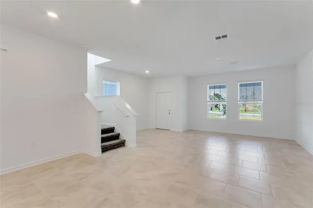 an empty room with windows