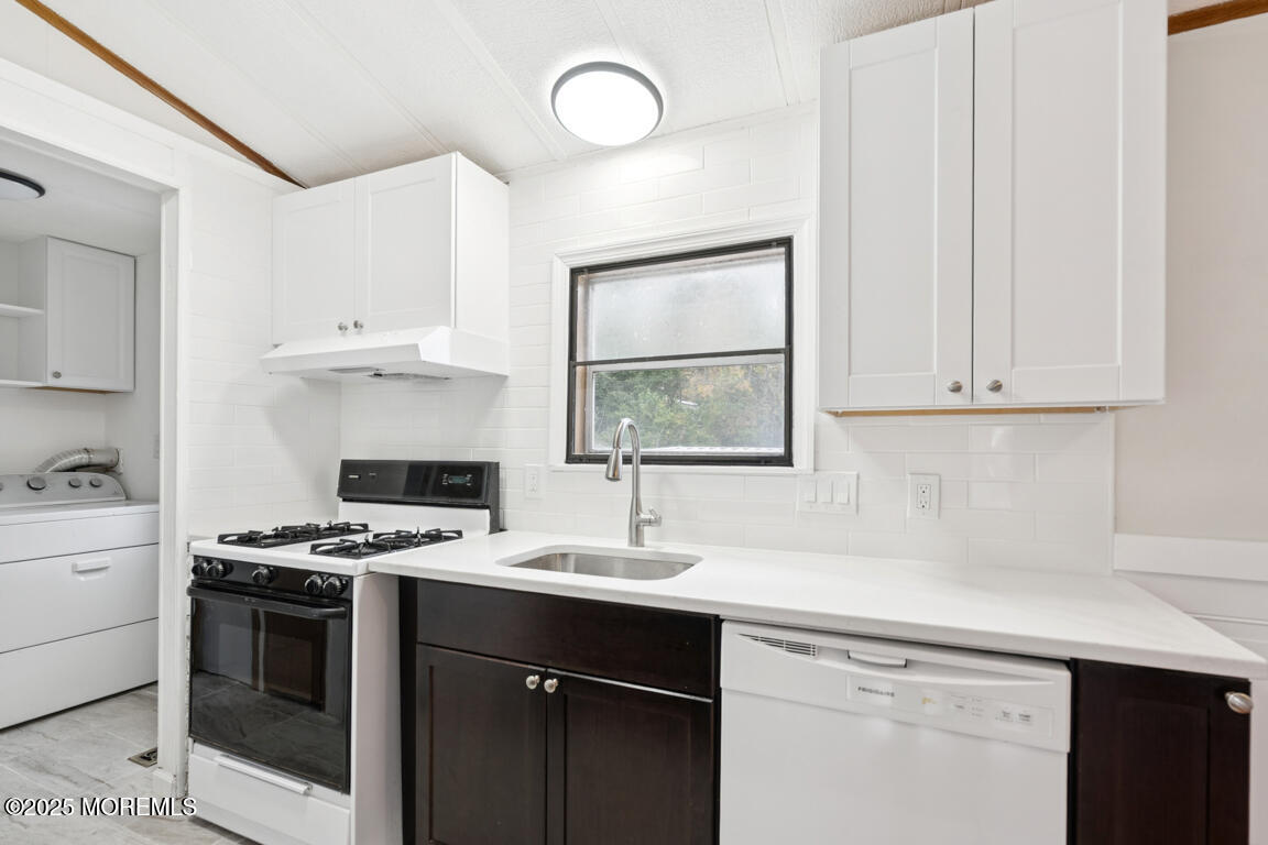 5 Fallow Drive Manalapan, NJ 07726 - Photo 11 of 24 a kitchen with cabinets appliances and a window