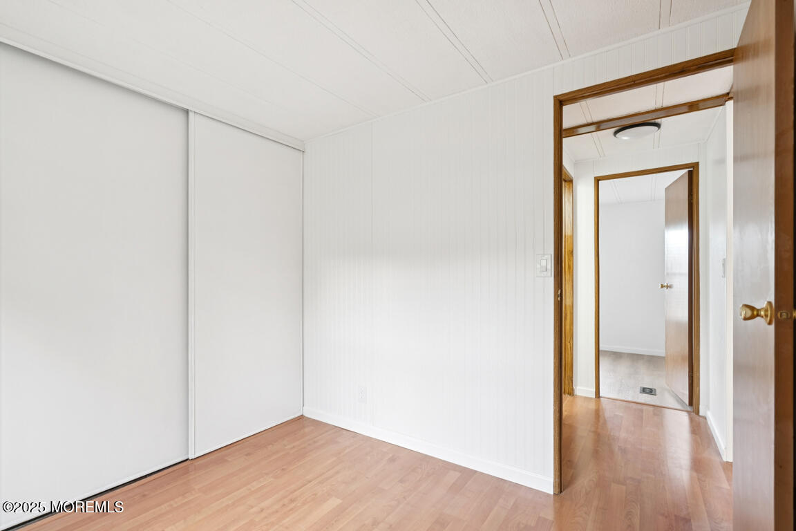 5 Fallow Drive Manalapan, NJ 07726 - Photo 14 of 24 a view of an empty room with wooden floor