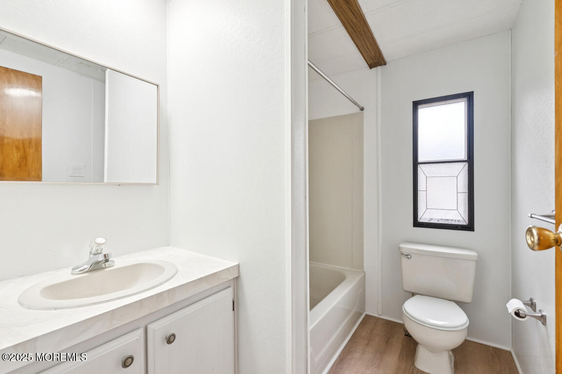 5 Fallow Drive Manalapan, NJ 07726 - Photo 17 of 24 a bathroom with a granite countertop sink toilet and mirror