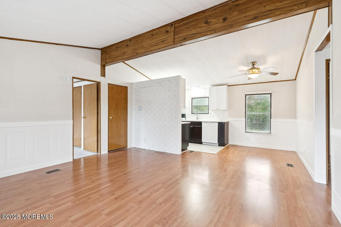 5 Fallow Drive Manalapan, NJ 07726 - Photo 5 of 24 a view of a kitchen with a refrigerator a ceiling fan and wooden floor