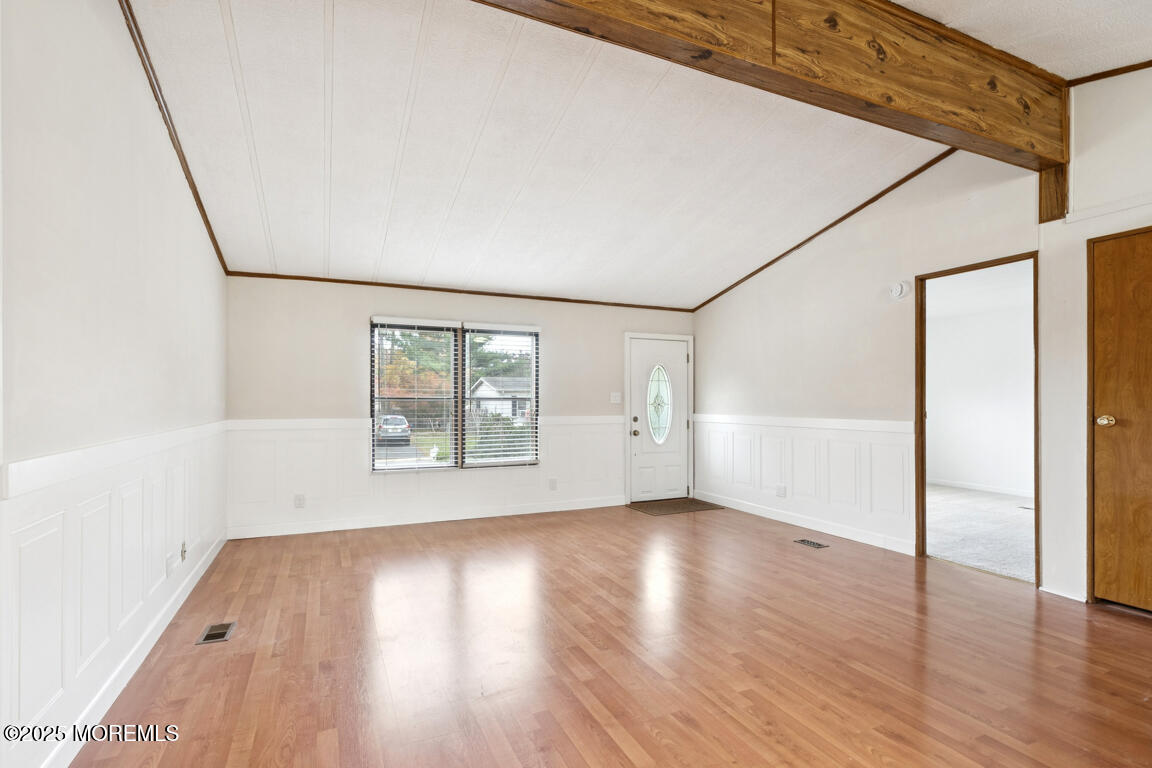 5 Fallow Drive Manalapan, NJ 07726 - Photo 6 of 24 an empty room with wooden floor and windows