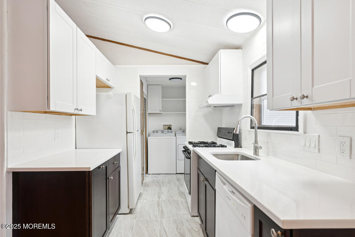5 Fallow Drive Manalapan, NJ 07726 - Photo 9 of 24 a kitchen with a sink a stove and cabinets