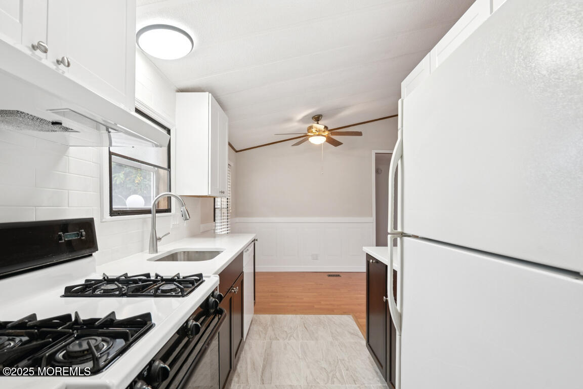 5 Fallow Drive Manalapan, NJ 07726 - Photo 10 of 24 a kitchen with stainless steel appliances granite countertop a stove and a refrigerator