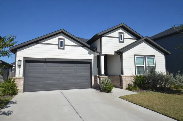 a front view of a house with yard