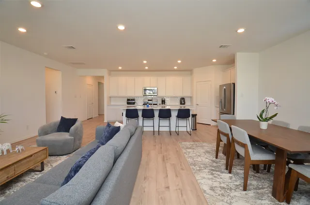 a living room with furniture and a table
