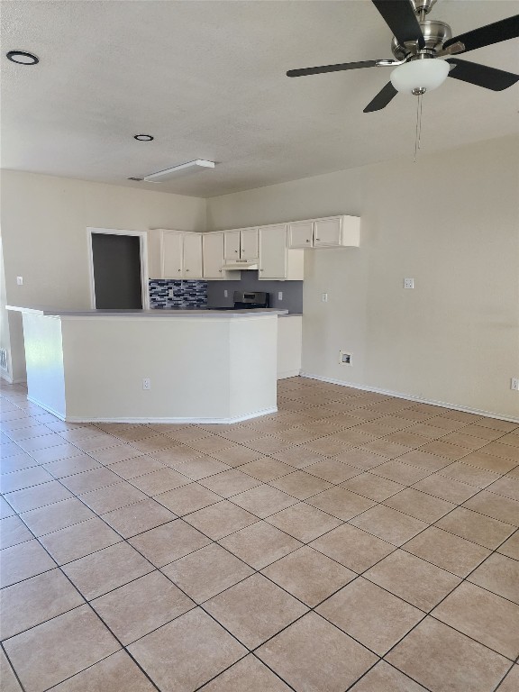 3102 Northwest Boulevard, Unit A Georgetown, TX 78628 - Photo 9 of 9 a view of a kitchen with stainless steel appliances cabinets and a kitchen counter top
