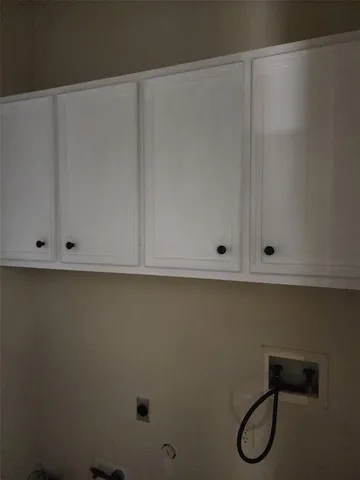 a kitchen with a sink cabinets and window