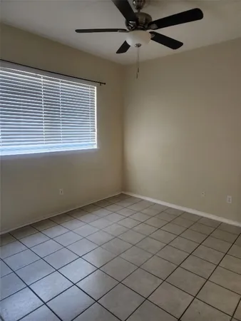 a view of an empty room and a window