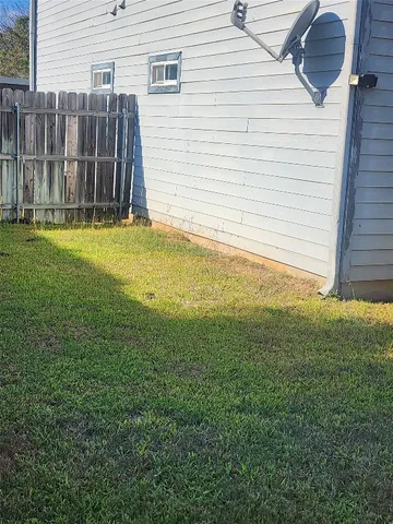 a view of backyard with small cabin