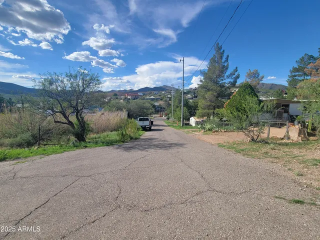 a view of a road with a building in the background