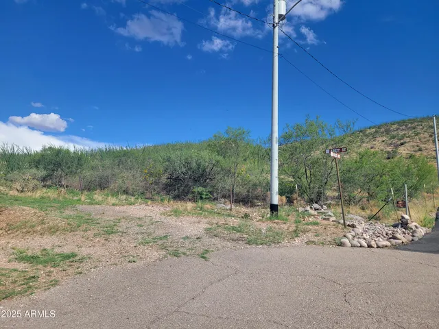 a view of a road with a yard