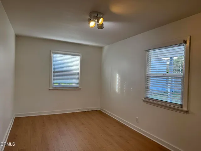 a view of an empty room with a window