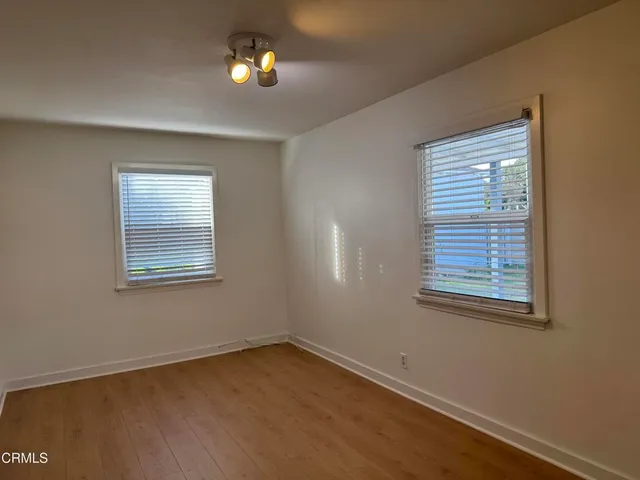 a view of an empty room with a window